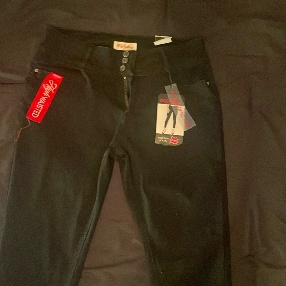 High waisted red bottom jeans.